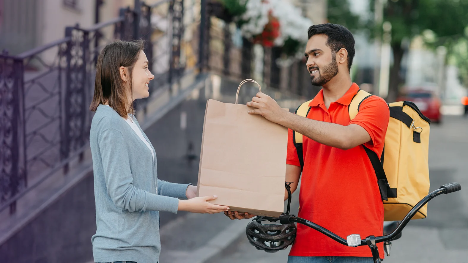 Garnas delivery rider handing package to customer